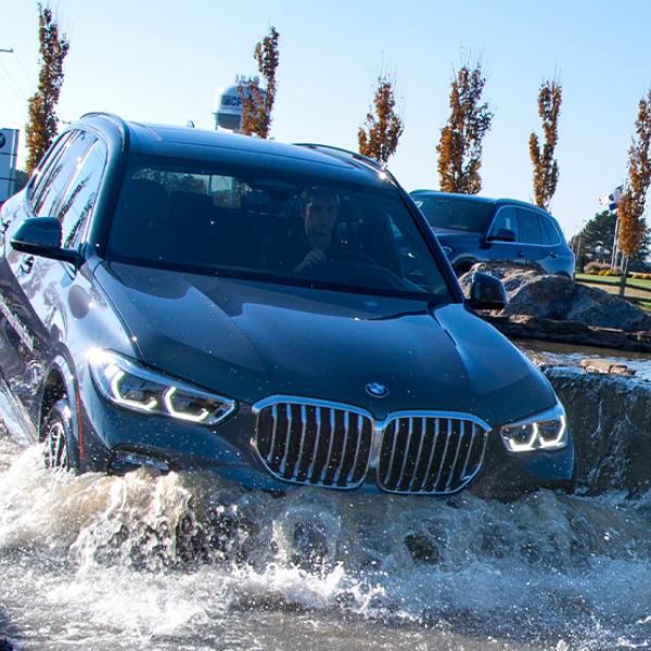 BMW SUV treading water on the course