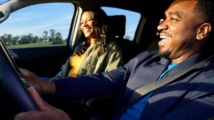 Smiling couple on a drive